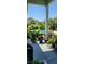 Cozy porch with a view of the pool and garden at 711 Farm Cottage Ln, Charleston, SC 29412
