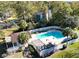Stunning aerial view of a community pool, sundeck, pergola, and palm trees at 8644 Roanoke Dr, North Charleston, SC 29406