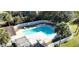 Aerial view of a community swimming pool with white fence and lounge chairs at 8644 Roanoke Dr, North Charleston, SC 29406