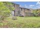 Spacious backyard with brick fire pit, lawn, patio, and a view of the home at 8644 Roanoke Dr, North Charleston, SC 29406