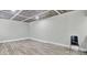 Large basement area with wood-look flooring and modern ceiling at 8644 Roanoke Dr, North Charleston, SC 29406