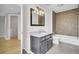 Bathroom features a single sink vanity with granite counters and a tub with tiled walls at 8644 Roanoke Dr, North Charleston, SC 29406