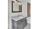Bathroom features a dark vanity, granite counters, and a tub with a tiled shower at 8644 Roanoke Dr, North Charleston, SC 29406