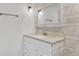 Elegant bathroom vanity features stylish mirror, modern fixtures, and white wooden accent wall at 8644 Roanoke Dr, North Charleston, SC 29406