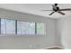 Bright bedroom with large windows, ceiling fan, and neutral wall color at 8644 Roanoke Dr, North Charleston, SC 29406