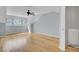 Spacious bedroom features hardwood floors, a large window, and a modern ceiling fan at 8644 Roanoke Dr, North Charleston, SC 29406