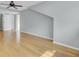 Bright bedroom features hardwood floors, a ceiling fan, and neutral wall color at 8644 Roanoke Dr, North Charleston, SC 29406