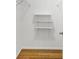 Walk-in closet features custom shelving, perfect for organizing clothes and storage at 8644 Roanoke Dr, North Charleston, SC 29406