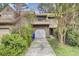 Charming townhome featuring a one-car garage and lush landscaping at 8644 Roanoke Dr, North Charleston, SC 29406