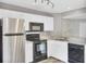 Kitchen featuring stainless steel refrigerator, black oven, and granite countertops at 8644 Roanoke Dr, North Charleston, SC 29406
