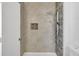 Beautiful shower with tile surround and rainfall shower head and modern fixture at 8644 Roanoke Dr, North Charleston, SC 29406