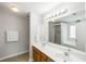 Bright bathroom featuring double sinks, a large mirror, and a shower/tub combo at 8986 N Red Maple Cir, Summerville, SC 29485