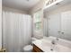 Bathroom featuring a shower with curtain, toilet, single vanity and large mirror at 8986 N Red Maple Cir, Summerville, SC 29485