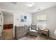 Bright Bedroom with gray chair, changing table and a sunny window view at 8986 N Red Maple Cir, Summerville, SC 29485