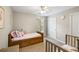 ' room featuring a daybed and a crib, designed with a warm and playful atmosphere at 8986 N Red Maple Cir, Summerville, SC 29485