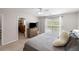 Light bedroom with a large window, a dresser, and a door to a walk-in closet at 8986 N Red Maple Cir, Summerville, SC 29485
