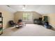 Spacious bonus room with carpet, ceiling fan, and natural light at 8986 N Red Maple Cir, Summerville, SC 29485
