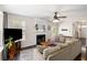 Comfortable living room featuring a fireplace, neutral colors, and plenty of natural light at 8986 N Red Maple Cir, Summerville, SC 29485