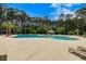 A luxurious community pool with ample seating and well-maintained landscaping at 8986 N Red Maple Cir, Summerville, SC 29485