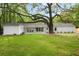 Manicured backyard with mature tree at 920 Julia St, Charleston, SC 29412