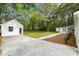 View of backyard with lawn and two outbuildings at 920 Julia St, Charleston, SC 29412