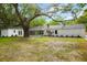 Large backyard and home exterior with mature trees at 920 Julia St, Charleston, SC 29412