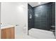 Modern bathroom features a blue tiled shower and new vanity at 920 Julia St, Charleston, SC 29412