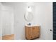 Stylish bathroom vanity with round mirror and modern fixtures at 920 Julia St, Charleston, SC 29412