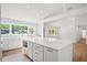 Modern kitchen with large island, marble backsplash, and windows providing great natural light at 920 Julia St, Charleston, SC 29412