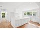 Bright and open kitchen featuring a spacious island, white countertops, and modern finishes at 920 Julia St, Charleston, SC 29412