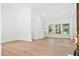 Bright and open living space with wood floors, freshly painted white walls and bright windows at 920 Julia St, Charleston, SC 29412