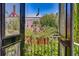 Balcony view framing lush greenery and neighborhood homes at 95 Ashley Ave # D, Charleston, SC 29401