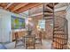 Stylish dining room with exposed brick, a spiral staircase, and a chandelier at 95 Ashley Ave # D, Charleston, SC 29401