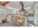 Bright kitchen with white cabinetry, stainless steel appliances, and a stylish island at 95 Ashley Ave # D, Charleston, SC 29401