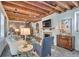 Inviting living room featuring exposed wood beams and a decorative fireplace at 95 Ashley Ave # D, Charleston, SC 29401