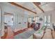 Bright living space with exposed beams, a comfortable sofa, and stylish decor at 95 Ashley Ave # D, Charleston, SC 29401