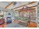 Inviting living room with exposed beams, brick accents, and comfortable seating at 95 Ashley Ave # D, Charleston, SC 29401