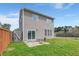 Backyard features a patio perfect for entertaining, grassy area and privacy fence at 9731 Stockport Cir, Summerville, SC 29485