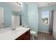 Bright bathroom featuring a single sink vanity with modern fixtures, white toilet, and a shower and tub combo at 9731 Stockport Cir, Summerville, SC 29485