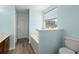 Bright bathroom featuring a bathtub and window view to the outside at 9731 Stockport Cir, Summerville, SC 29485