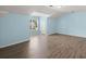 Bedroom with sloped ceilings, wood-look floors, and a large window at 9731 Stockport Cir, Summerville, SC 29485