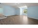 Bedroom featuring wood-look floors, and a large window at 9731 Stockport Cir, Summerville, SC 29485