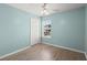 Bright bedroom featuring a ceiling fan, window with blinds, and a white closet door at 9731 Stockport Cir, Summerville, SC 29485
