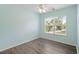 Bright bedroom featuring a ceiling fan and a window with a view to the outside neighborhood at 9731 Stockport Cir, Summerville, SC 29485