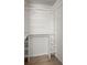 Bright walk-in closet boasts custom white shelving, ample storage and closet rod at 9731 Stockport Cir, Summerville, SC 29485