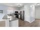 Modern kitchen with stainless steel appliances, granite countertops, and white cabinets at 9731 Stockport Cir, Summerville, SC 29485