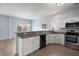 Modern kitchen featuring stainless steel appliances, granite countertops, and white cabinets at 9731 Stockport Cir, Summerville, SC 29485