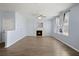 Spacious living room with a cozy fireplace, ample natural light, and neutral paint at 9731 Stockport Cir, Summerville, SC 29485
