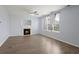 Light and bright living room featuring a fireplace, ceiling fan, and large windows at 9731 Stockport Cir, Summerville, SC 29485