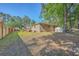 Large, private backyard with mature trees and a mix of open lawn and shaded areas at 100 Lipman St, Summerville, SC 29483